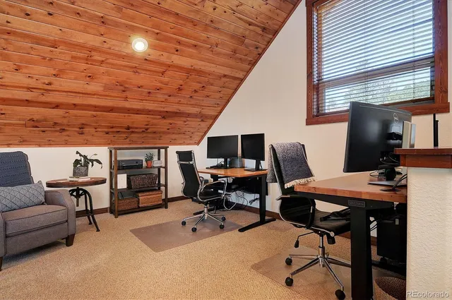 a living room with furniture a dining table and chairs