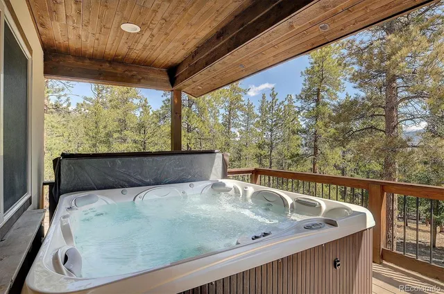 a view of house with outdoor space and sitting area