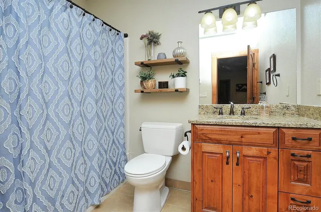 a view of balcony with wooden floor and outdoor seating