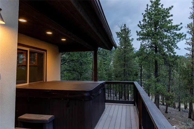 a balcony with furniture and wooden floor