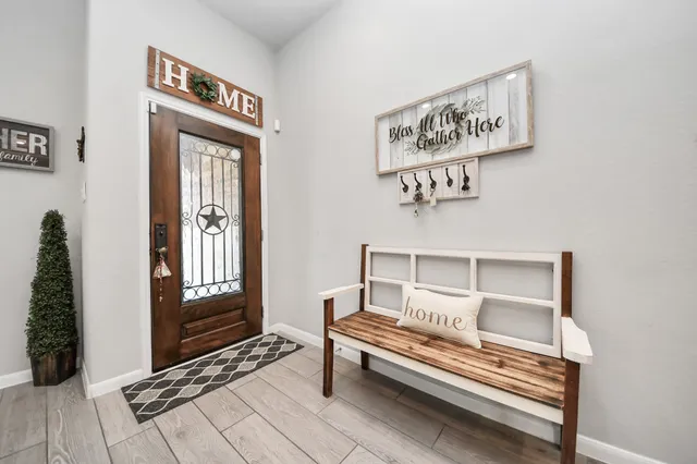 a view of livingroom with furniture and front door