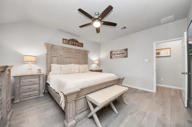 a bedroom with a bed and window