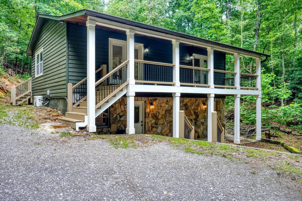 45 Mountain Stream Road Murphy, NC 28906 - Photo 21 of 33 a view of a house with a yard and large windows