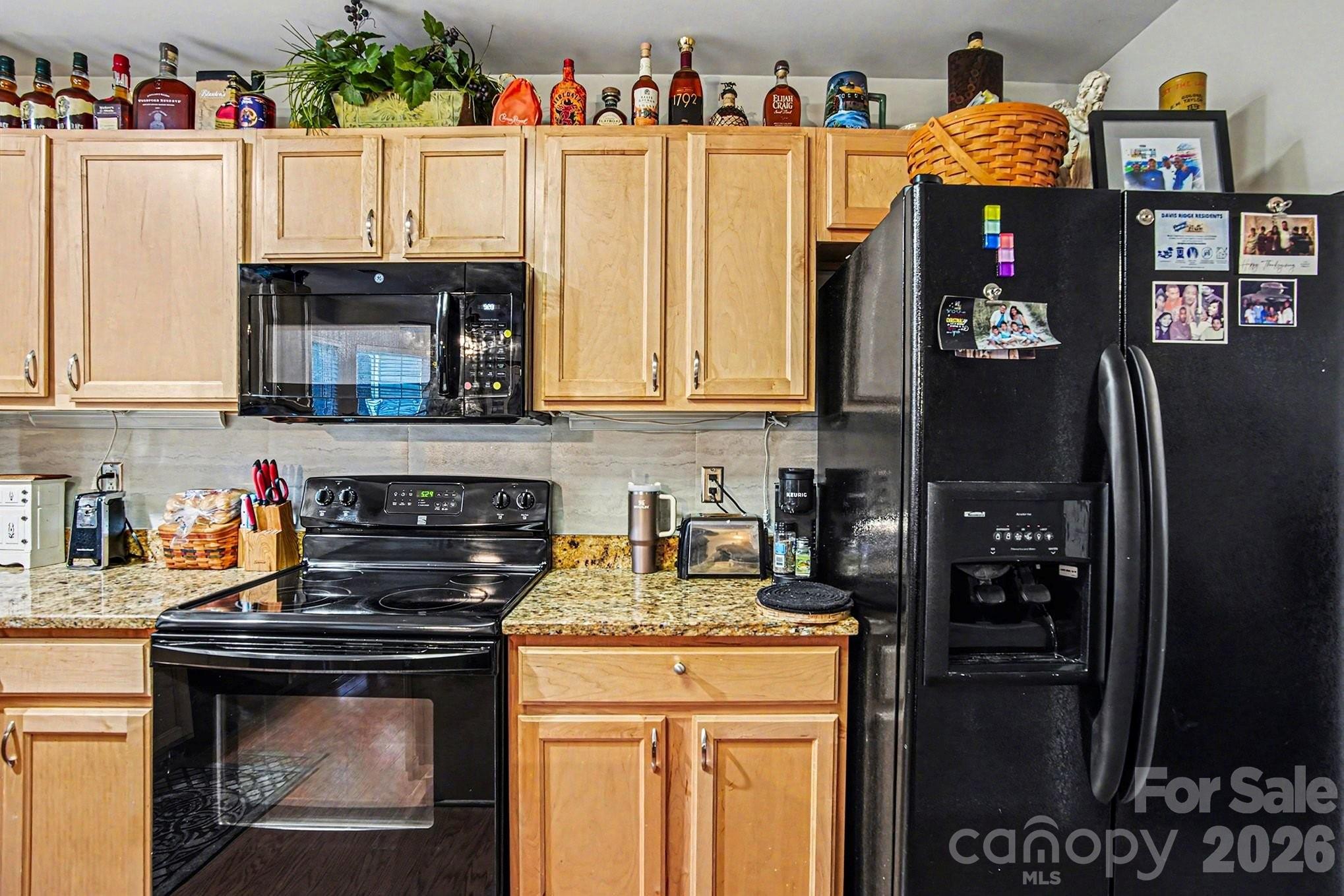 5625 Davis Ridge Drive Charlotte, NC 28269 - Photo 13 of 27 a kitchen with stainless steel appliances granite countertop a refrigerator and a stove