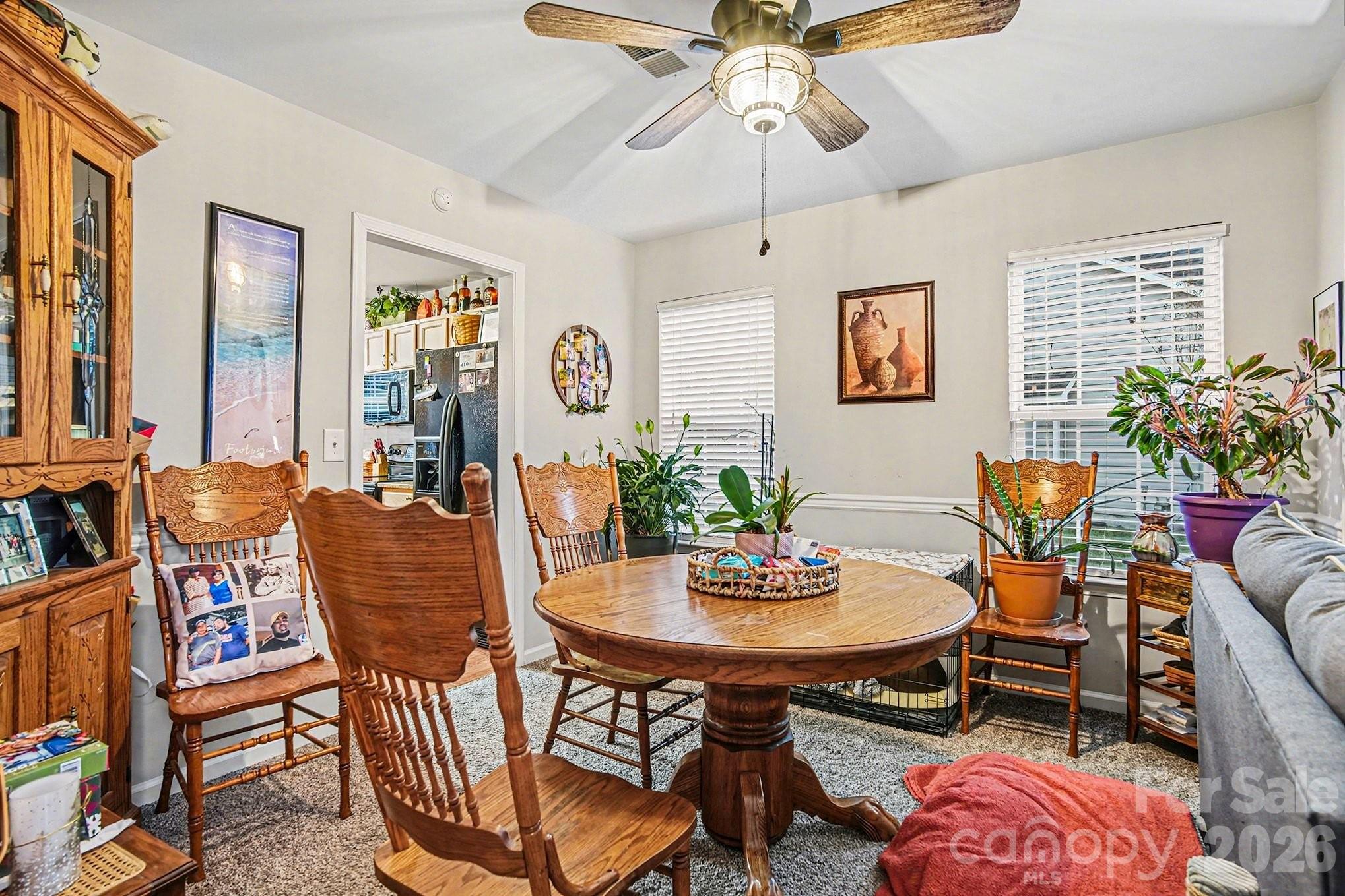 5625 Davis Ridge Drive Charlotte, NC 28269 - Photo 14 of 27 a view of a dining room with furniture and chandelier
