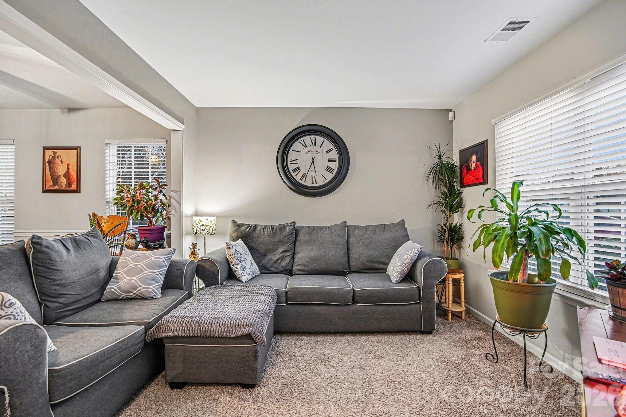 5625 Davis Ridge Drive Charlotte, NC 28269 - Photo 16 of 27 a living room with furniture and a potted plant