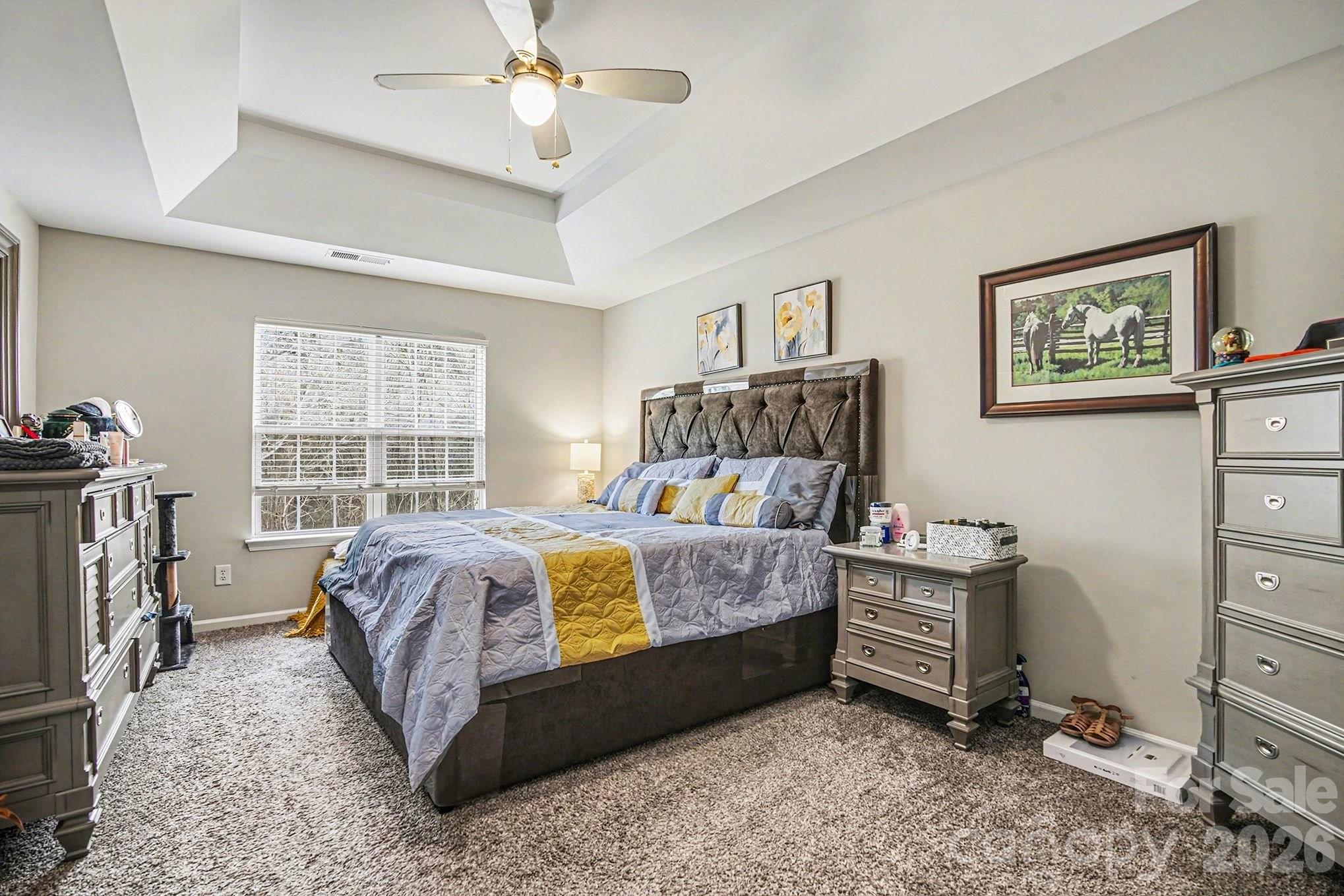 5625 Davis Ridge Drive Charlotte, NC 28269 - Photo 18 of 27 a bed room with a bed and a window