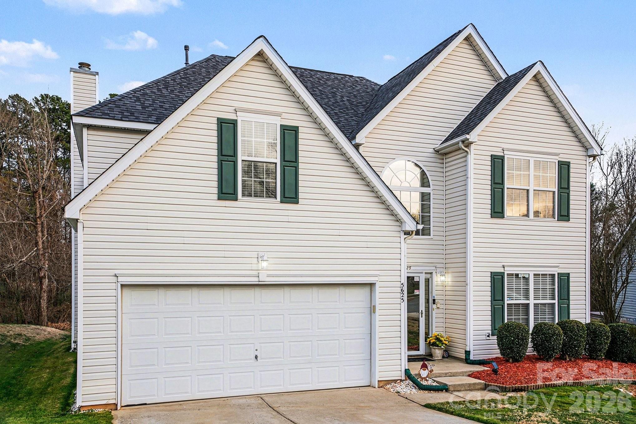 5625 Davis Ridge Drive Charlotte, NC 28269 - Photo 2 of 27 a view of a house with yard