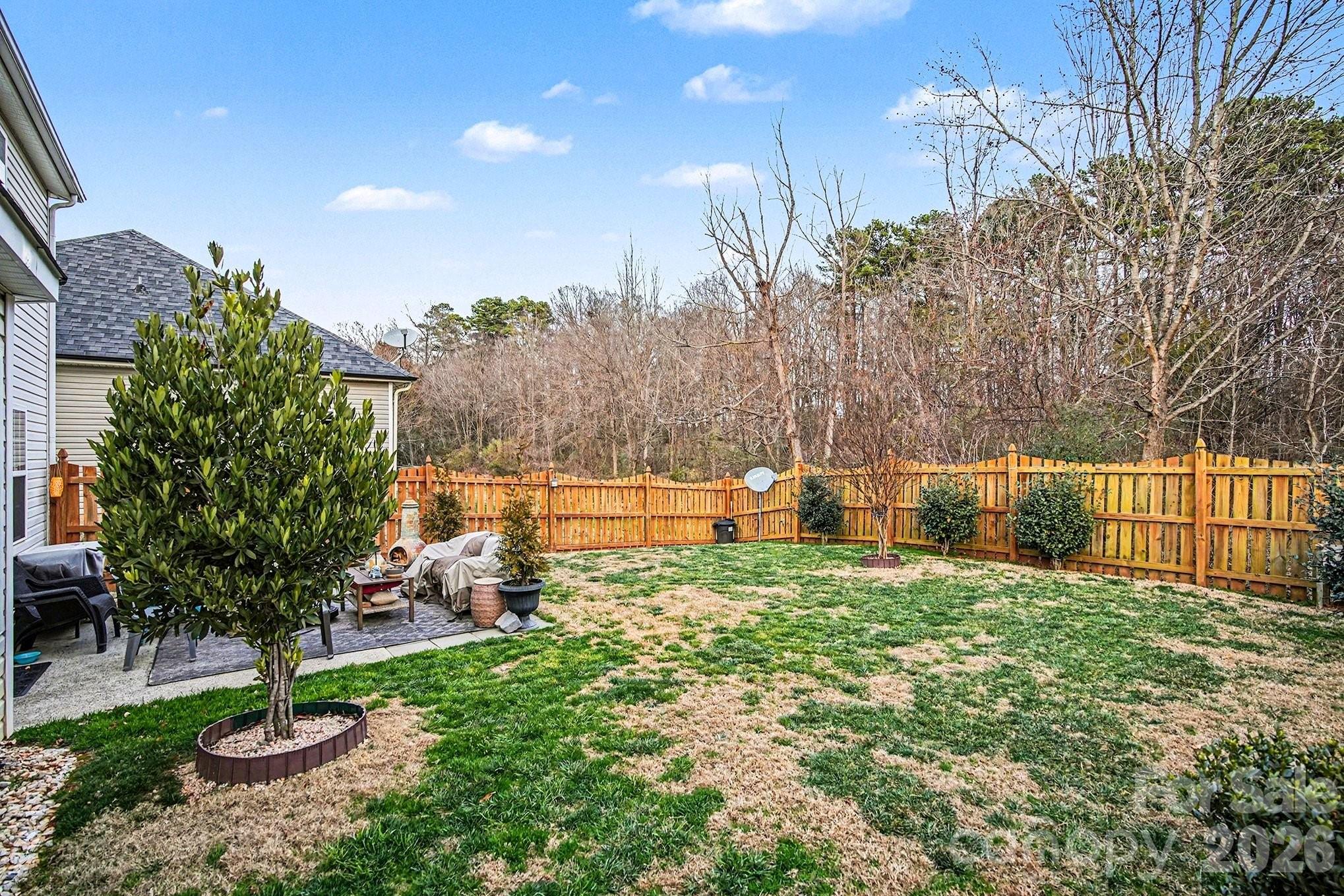 5625 Davis Ridge Drive Charlotte, NC 28269 - Photo 26 of 27 a view of a backyard with sitting area