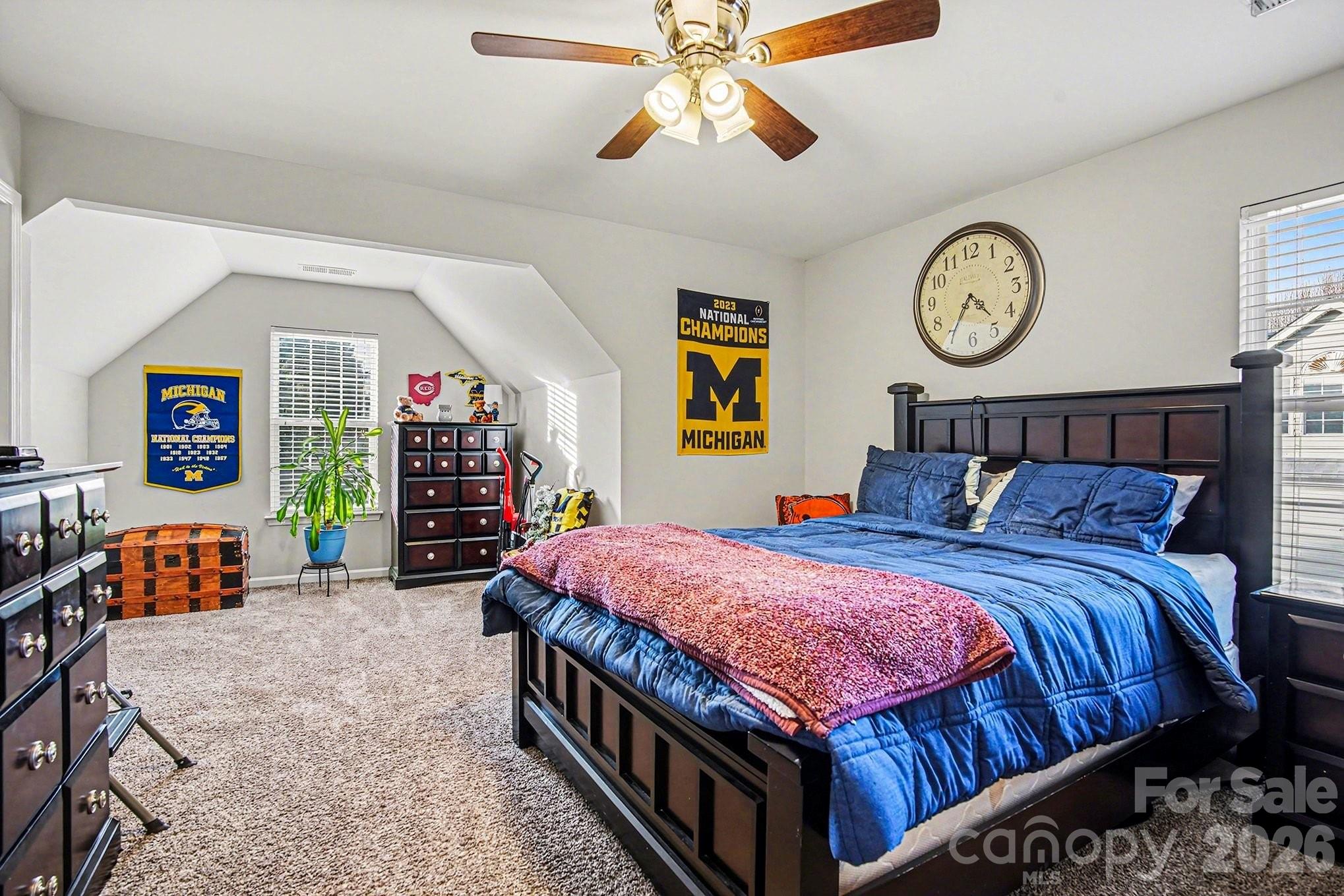 5625 Davis Ridge Drive Charlotte, NC 28269 - Photo 6 of 27 a bedroom with bed and wooden floor