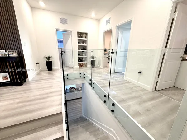 a view of a living room and entryway