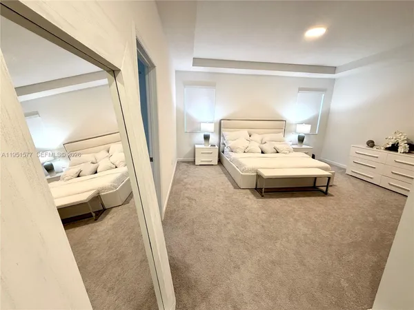 a bedroom with bed and a dresser