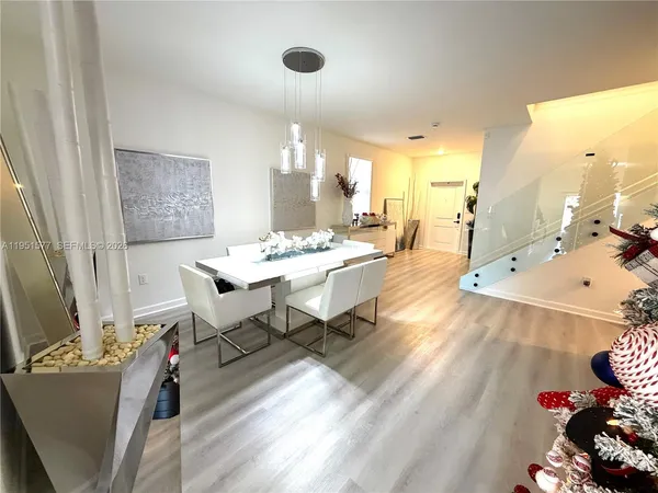 a dining room with a table and chairs