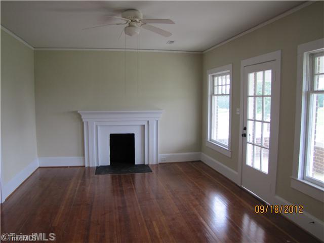 3635 Smithtown Road East Bend, NC 27018 - Photo 2 of 13 Living Room. Beautiful heart pine hardwoods throughout home. High ceilings and tons of natural light. FP is decorative only. Very spacious Home w/tons of character & charm.