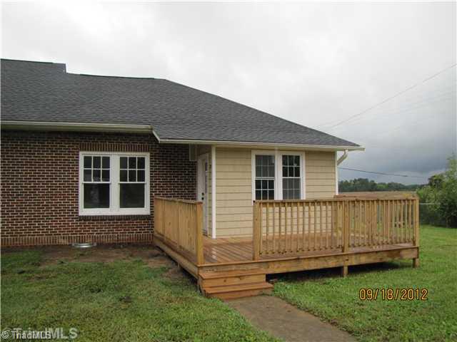 3635 Smithtown Road East Bend, NC 27018 - Photo 12 of 13 Exterior Back. Large Deck perfect for grilling on.