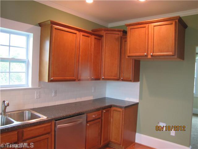 3635 Smithtown Road East Bend, NC 27018 - Photo 5 of 13 Kitchen. Tons of cabinets & counter space. Stainless Steel built-in microwave & dishwasher. Large pantry for additional storage. Can lights for better lighting.