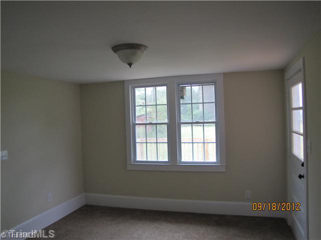 3635 Smithtown Road East Bend, NC 27018 - Photo 6 of 13 Den/Family/Great Room. Located off of Kitchen and leads to brand new Deck. Perfect TV room. Can be used as anything. New carpet.
