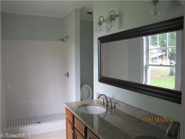 3635 Smithtown Road East Bend, NC 27018 - Photo 8 of 13 Master Bath/Spa. Beautifiul Master Bath, 13 8" x 13 . Plenty of space. Double sink granite vanity top. New fixtures. Bathroom leads to large walk-in Master Closet.
