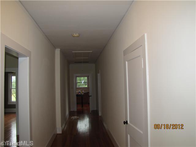 3635 Smithtown Road East Bend, NC 27018 - Photo 9 of 13 Other. Very long and wide hallway. Great use of space to decorate. Original to home. Hardwood floors.