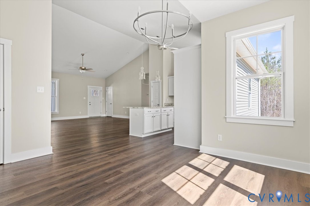 1191 Lewiston Plank Road Burkeville, VA 23922 - Photo 12 of 29 a view of an empty room with wooden floor and a window