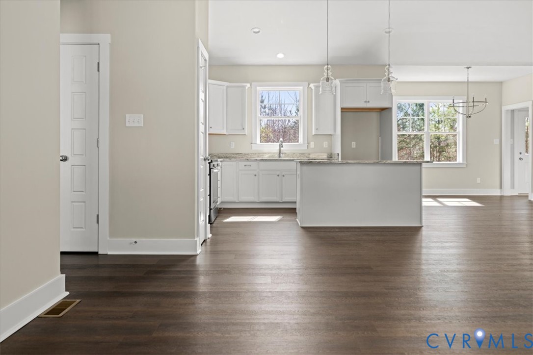 1191 Lewiston Plank Road Burkeville, VA 23922 - Photo 2 of 29 a large kitchen with hardwood floor and a window