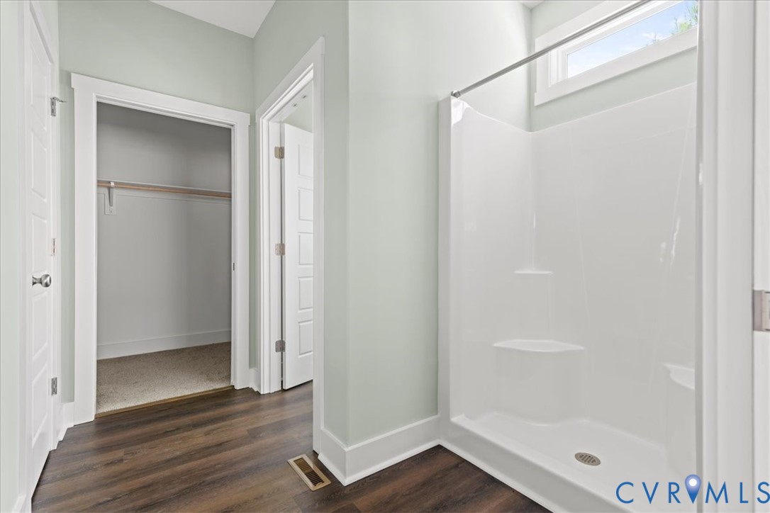 1191 Lewiston Plank Road Burkeville, VA 23922 - Photo 21 of 29 a bathroom with a glass shower door