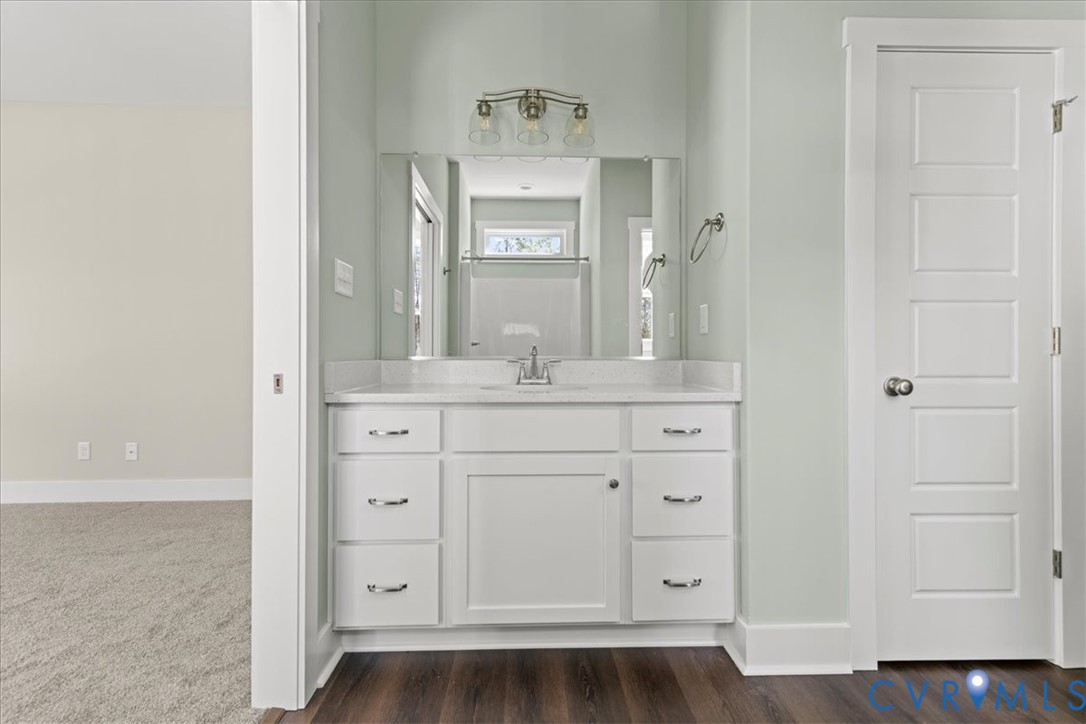 1191 Lewiston Plank Road Burkeville, VA 23922 - Photo 22 of 29 a bathroom with a granite countertop sink and a mirror