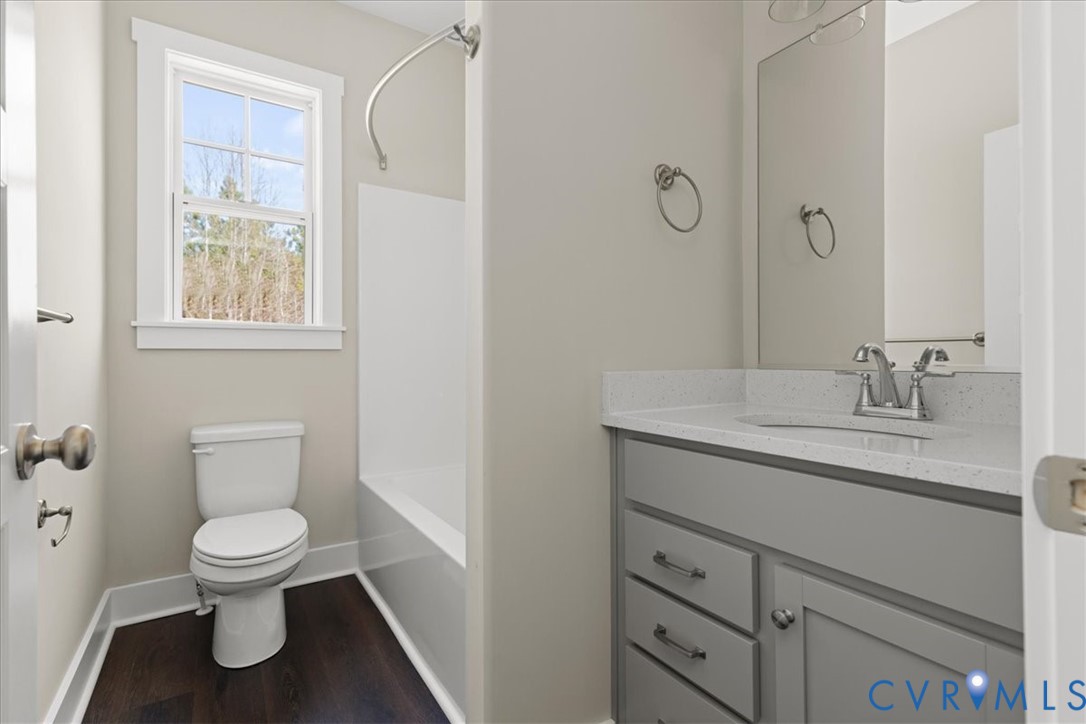 1191 Lewiston Plank Road Burkeville, VA 23922 - Photo 25 of 29 a bathroom with a toilet sink and mirror