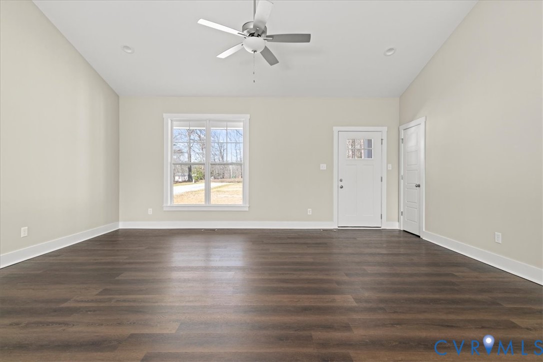 1191 Lewiston Plank Road Burkeville, VA 23922 - Photo 6 of 29 a view of an empty room with wooden floor and a window