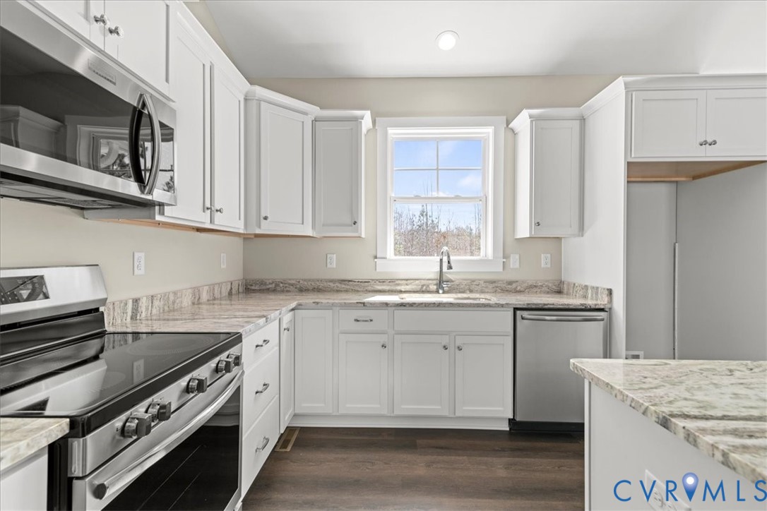 1191 Lewiston Plank Road Burkeville, VA 23922 - Photo 8 of 29 a kitchen with stainless steel appliances granite countertop a stove and a sink
