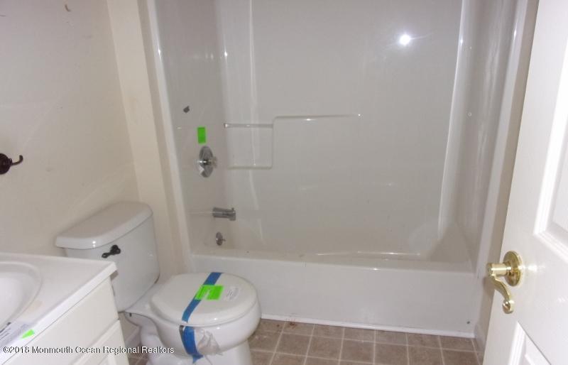 121 Brigantine Road Manahawkin, NJ 08050 - Photo 3 of 4 a bathroom with a bathtub and a shower