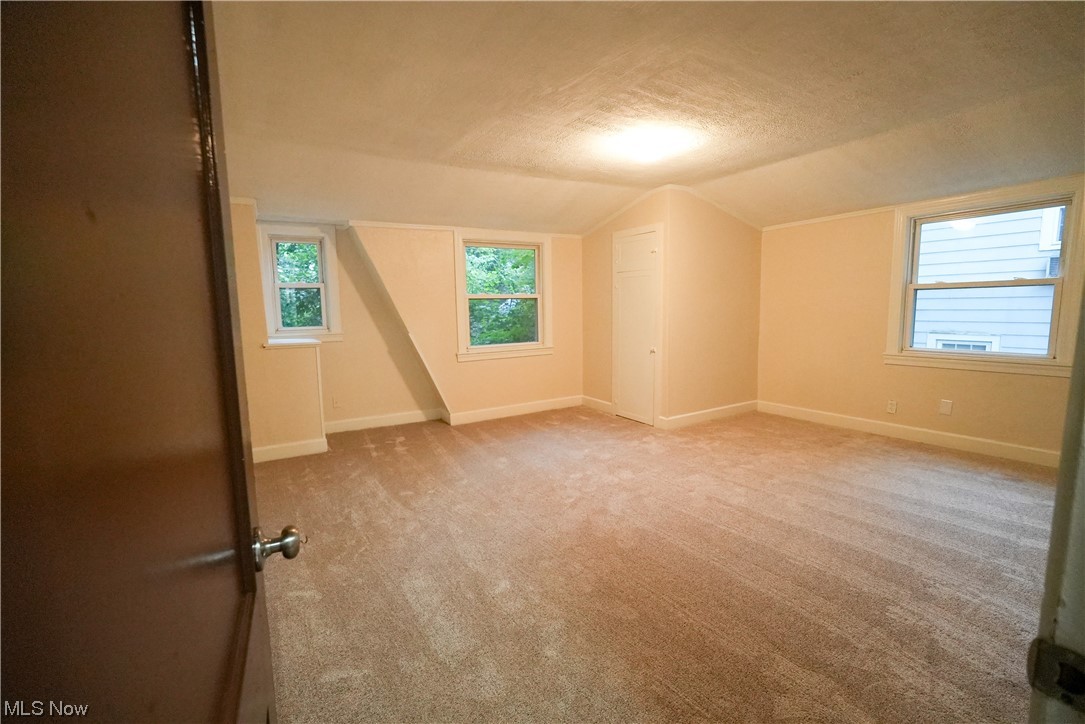 664 Ecton Road Akron, OH 44303 - Photo 22 of 35 Carpeted empty room and a textured ceiling