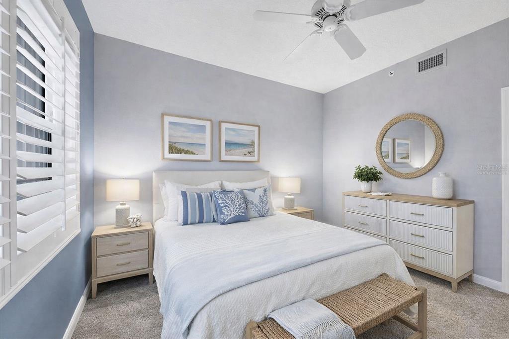 13113 Gasparilla Road, Unit 403 Placida, FL 33946 - Photo 31 of 62 a bedroom with a bed and a chandelier