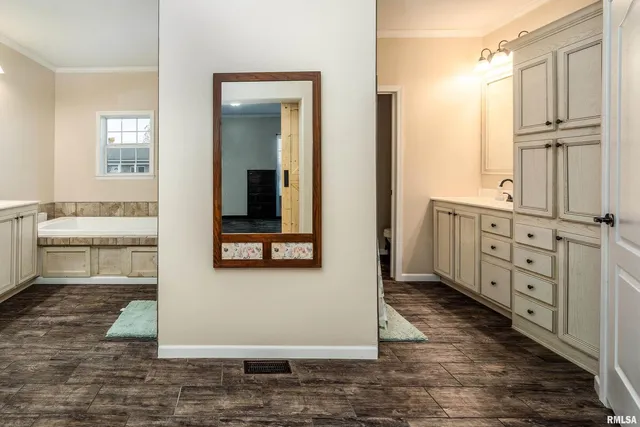 a view of a bathroom with sink and mirror
