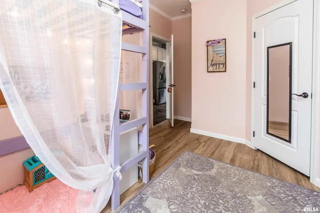 a view of entryway with wooden floor and stairs