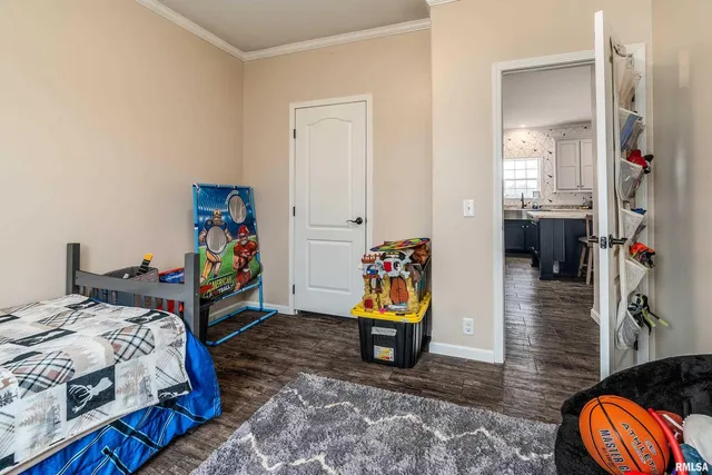 a bed room with a bed and a mirror