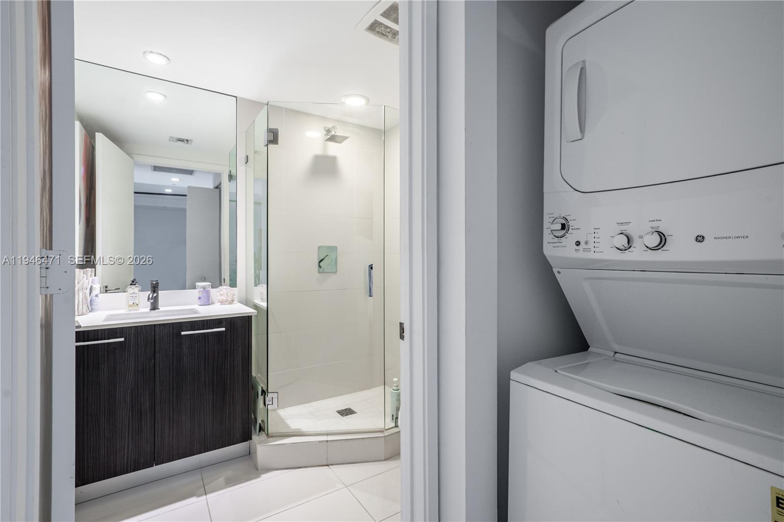 45 Southwest 9th Street, Unit 1205 Miami, FL 33130 - Photo 19 of 27 a bathroom with a sink a toilet and shower