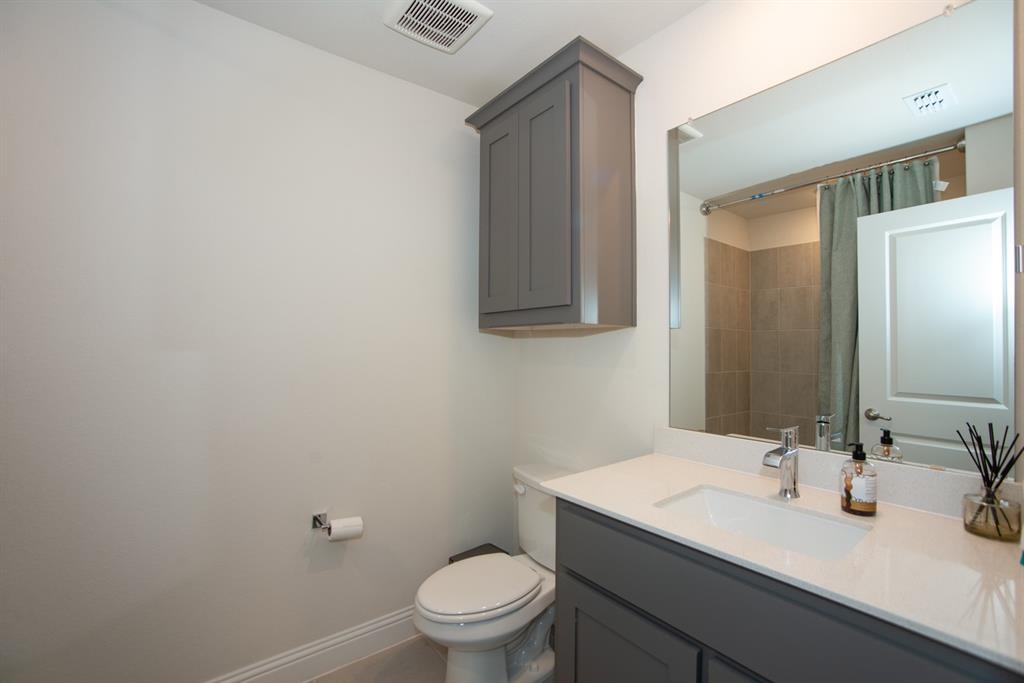 3813 Oldham Road Little Elm, TX 75068 - Photo 21 of 27 Full bathroom with vanity and a shower with curtain