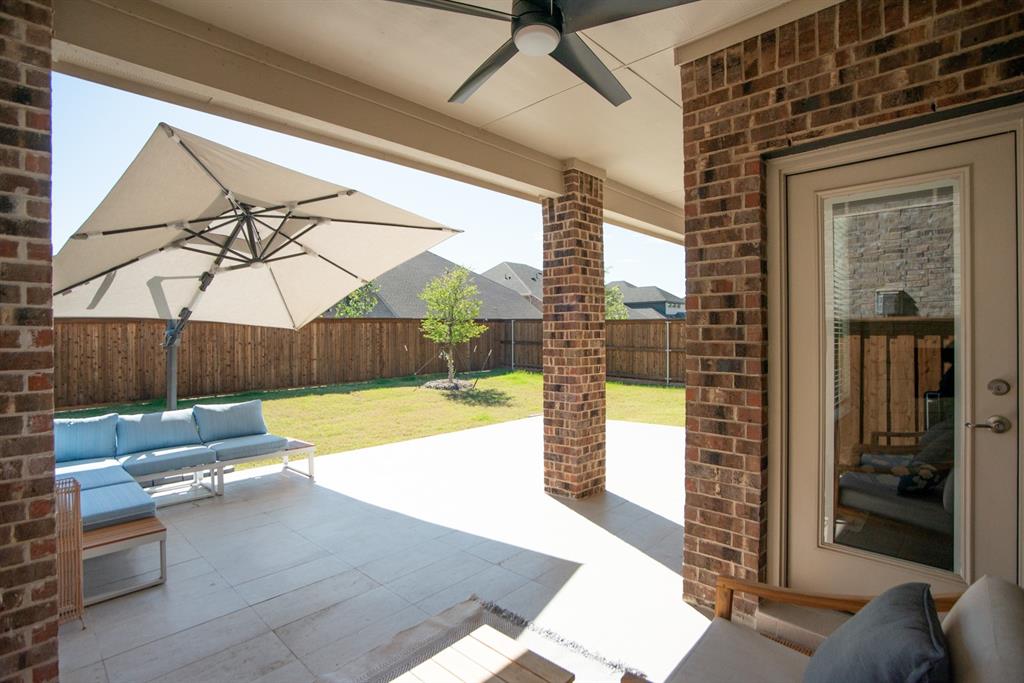 3813 Oldham Road Little Elm, TX 75068 - Photo 23 of 27 Fenced backyard with outdoor seating, a patio area, and a ceiling fan