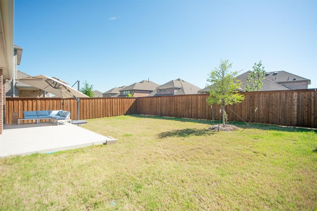 3813 Oldham Road Little Elm, TX 75068 - Photo 26 of 27 Fenced backyard featuring a patio, outdoor furniture, and a residential view