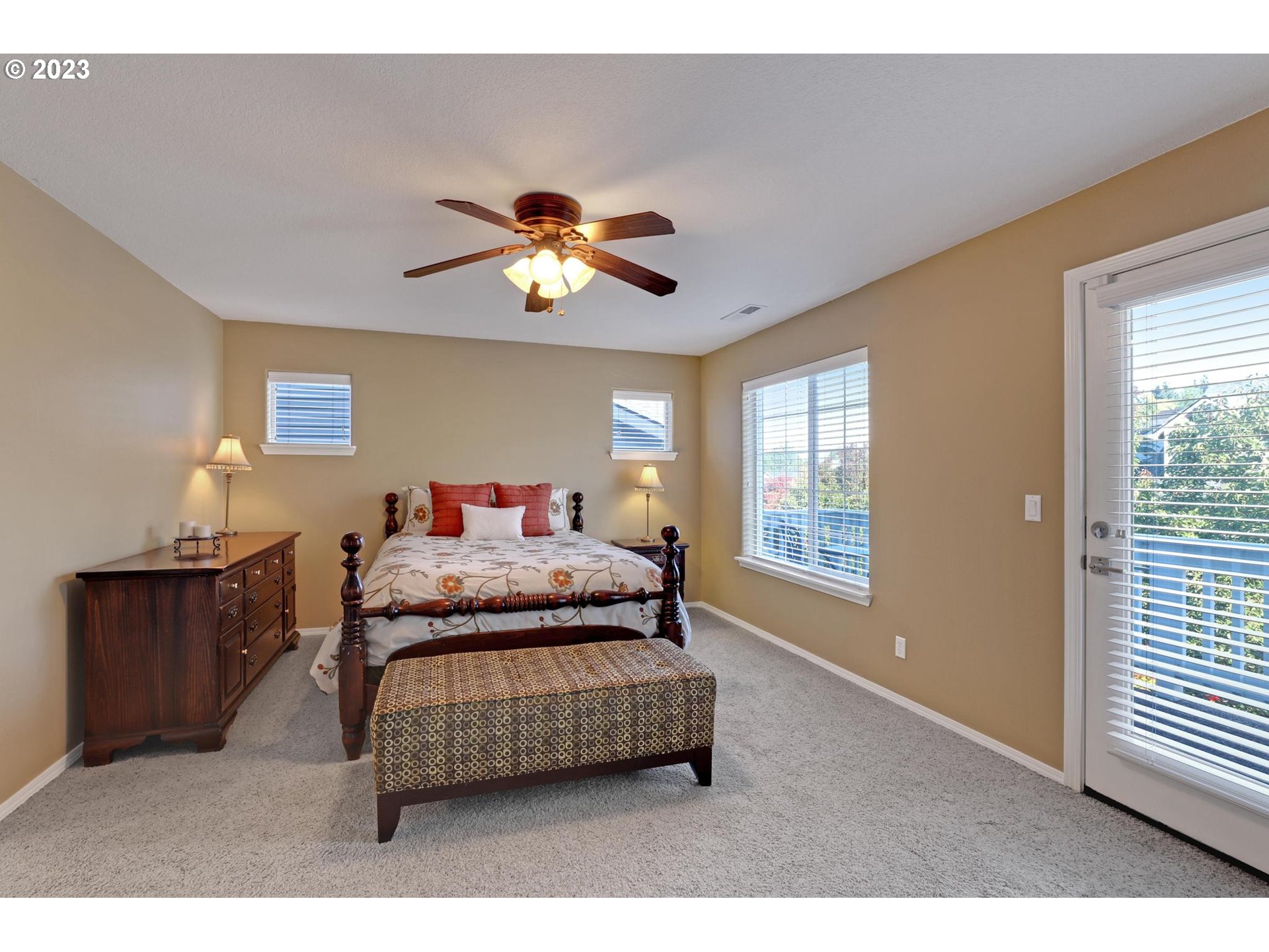 10698 Southwest Washington Street Portland, OR 97225 - Photo 14 of 25 a bedroom with a bed and a chandelier