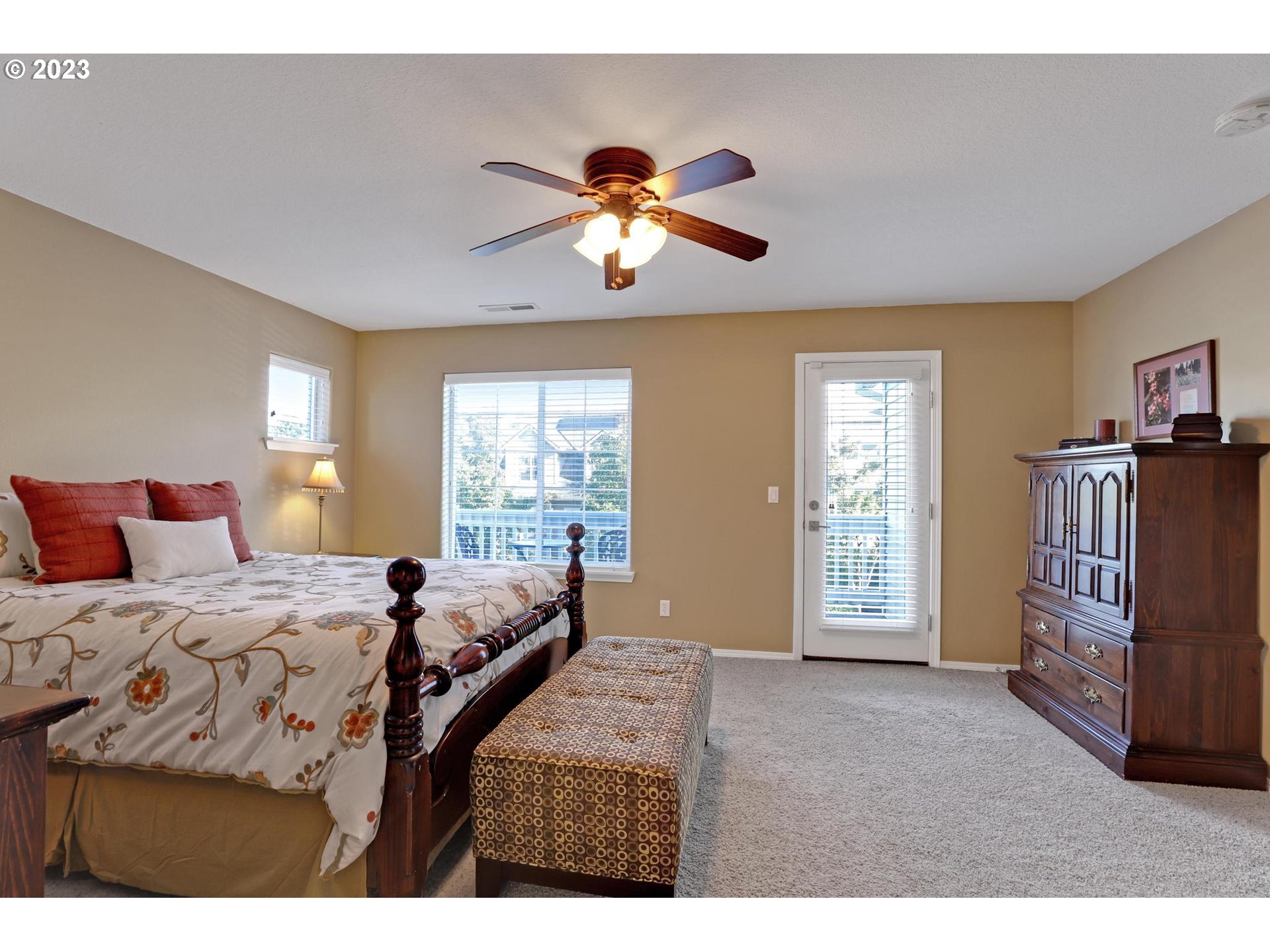 10698 Southwest Washington Street Portland, OR 97225 - Photo 15 of 25 a bedroom with a bed and a chandelier