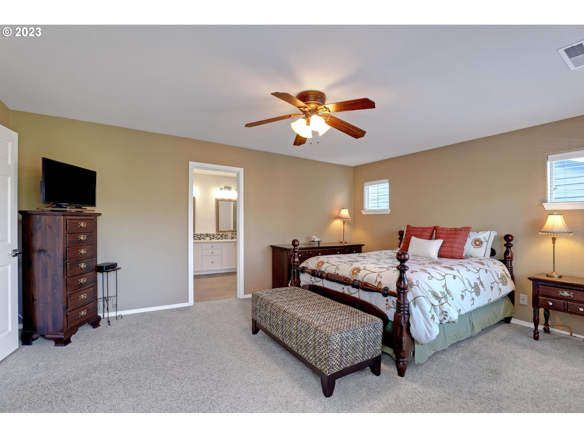 10698 Southwest Washington Street Portland, OR 97225 - Photo 16 of 25 a bedroom with a bed and a tv