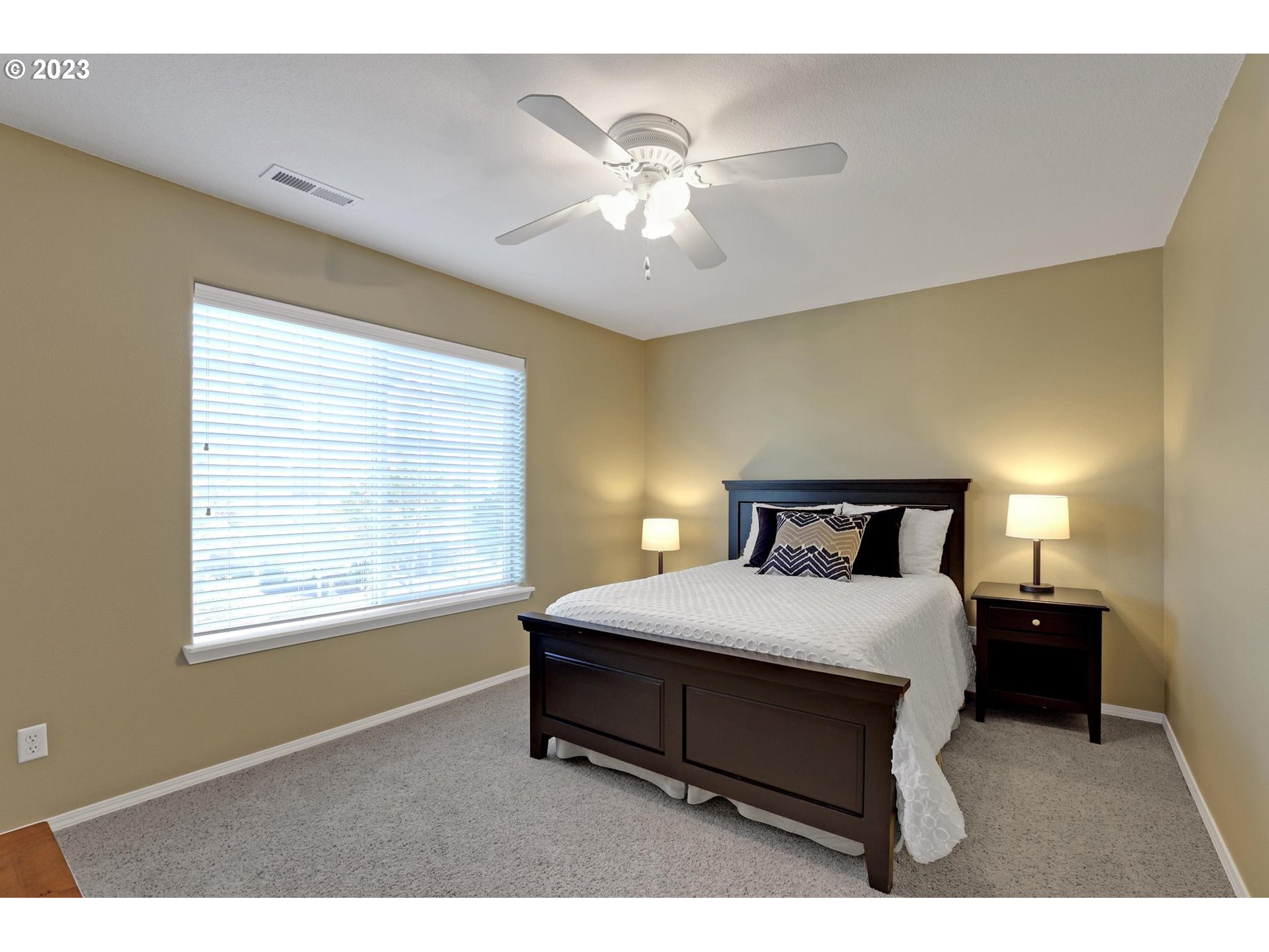 10698 Southwest Washington Street Portland, OR 97225 - Photo 18 of 25 a bedroom with a bed and window