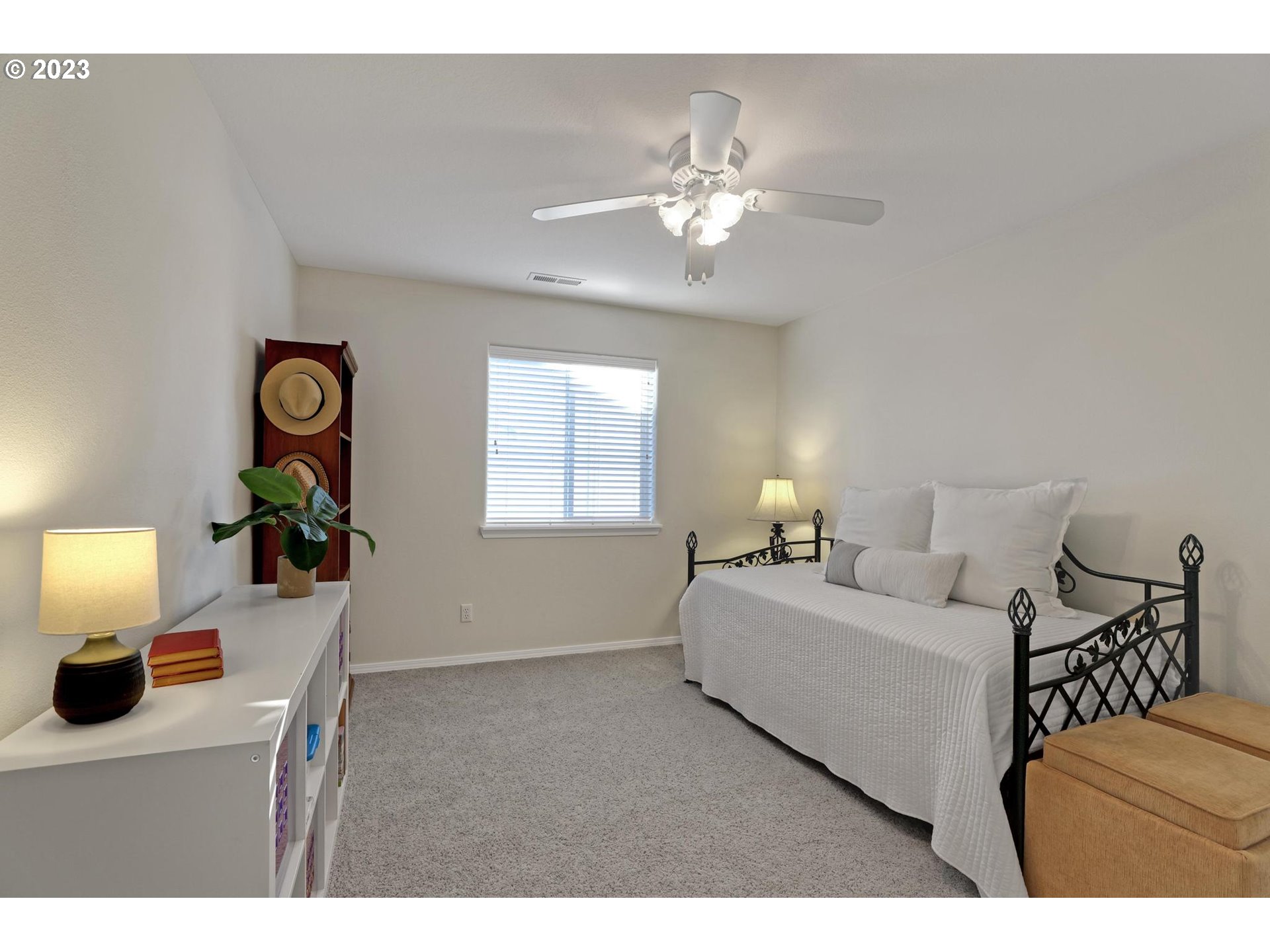 10698 Southwest Washington Street Portland, OR 97225 - Photo 19 of 25 a bedroom with a bed and a lamp