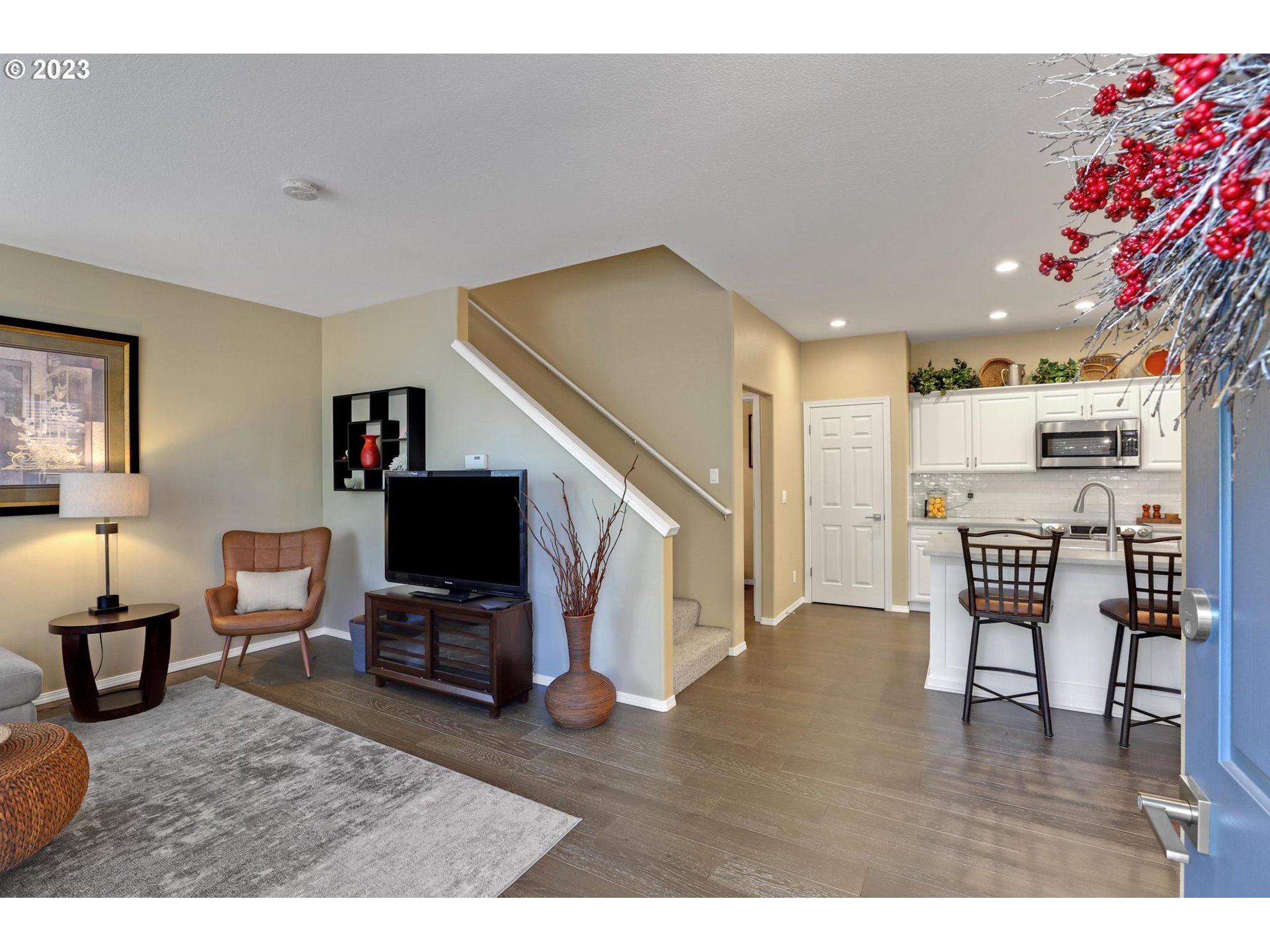 10698 Southwest Washington Street Portland, OR 97225 - Photo 3 of 25 a living room with furniture and a flat screen tv