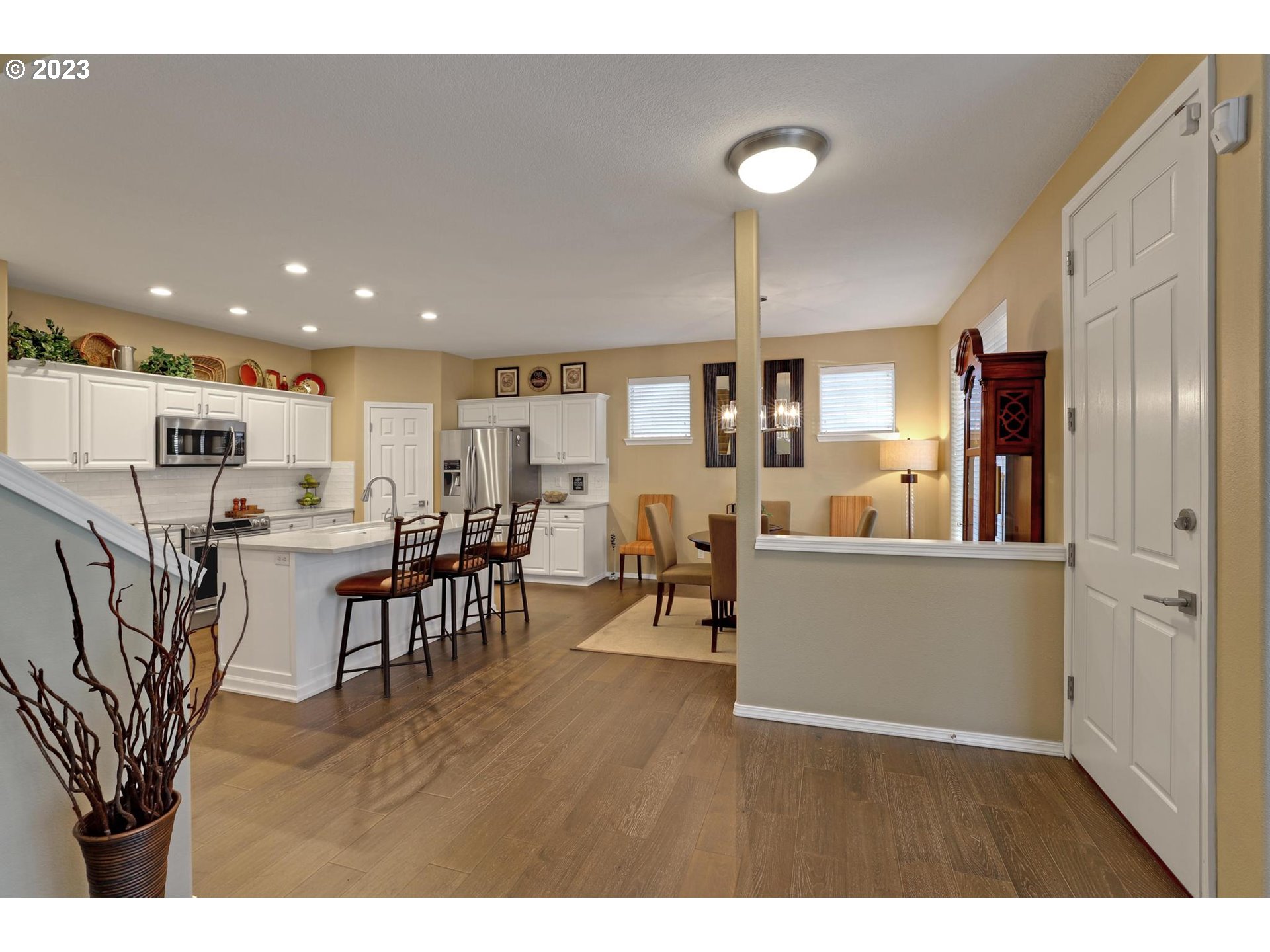 10698 Southwest Washington Street Portland, OR 97225 - Photo 6 of 25 a living room with stainless steel appliances kitchen island granite countertop furniture and a living room