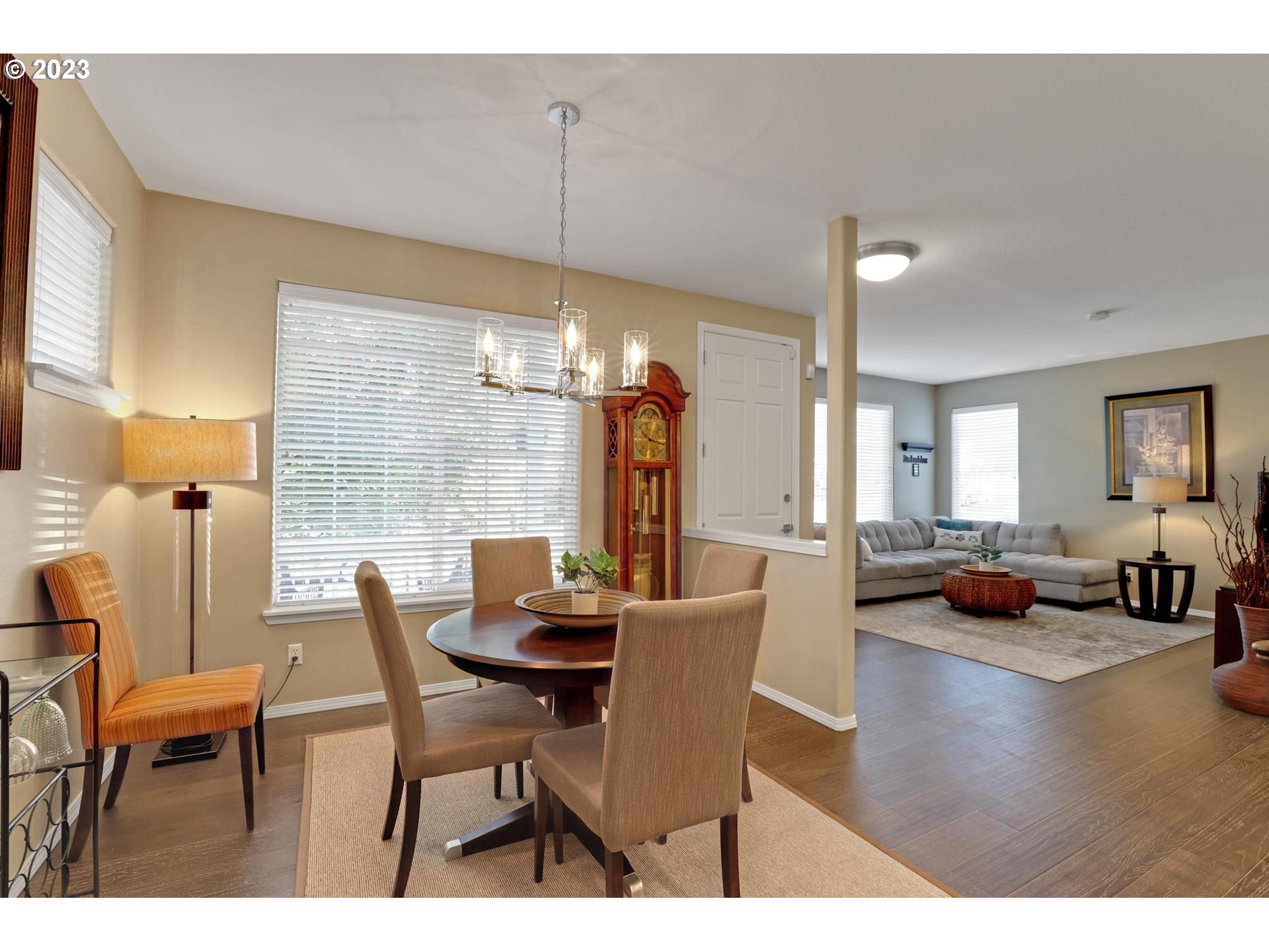 10698 Southwest Washington Street Portland, OR 97225 - Photo 7 of 25 a view of a dining room with furniture and wooden floor