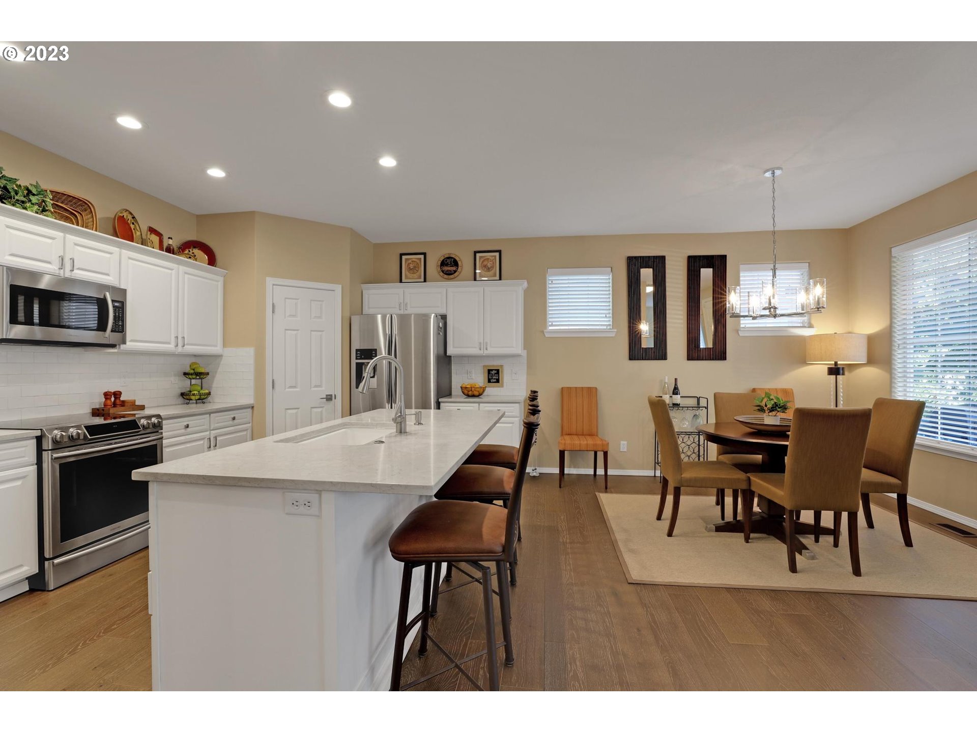 10698 Southwest Washington Street Portland, OR 97225 - Photo 10 of 25 a view of kitchen with cabinets table and chairs