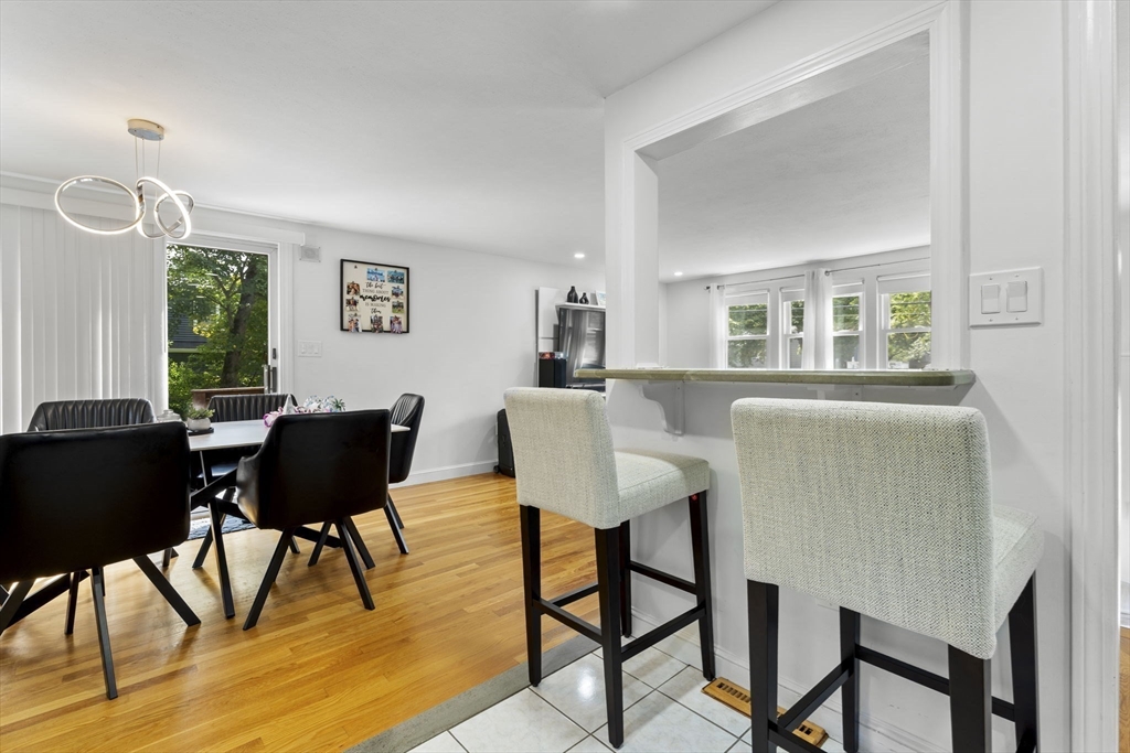 8 Governor Fuller Road Billerica, MA 01821 - Photo 16 of 33 a view of a dining room with furniture and wooden floor
